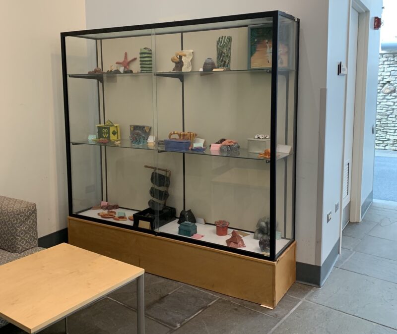 glass display case with art projects