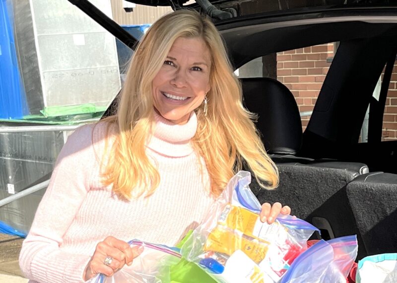 Kelly Edmondson with Food Pantry donations