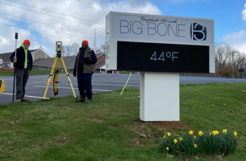 Land Surveying students Macalister Keeley and Bryant Favors working on the survey for Big Bone Baptist Church