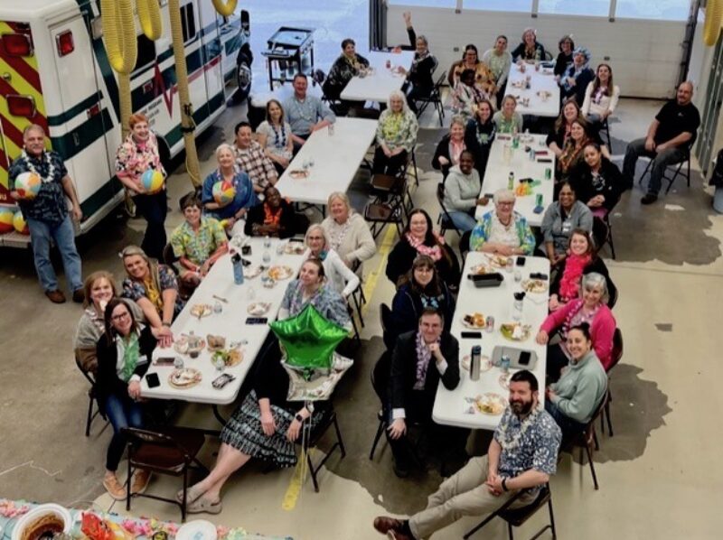 Faculty and staff members at HPS Hawaiian luau division meeting