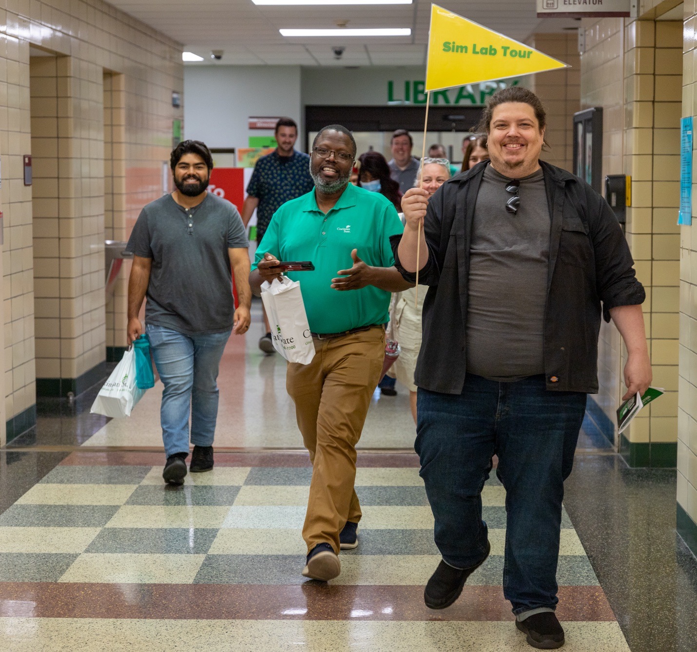 Convocation 2023 - employees on the way to the SIM Lab tour