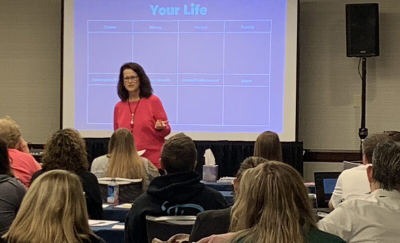 Professor Judy Marshall leading a workshop session for employees at CyberPay