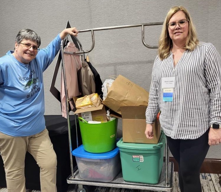 Janice Young and Kara Lewis with donations for Cincinnati State