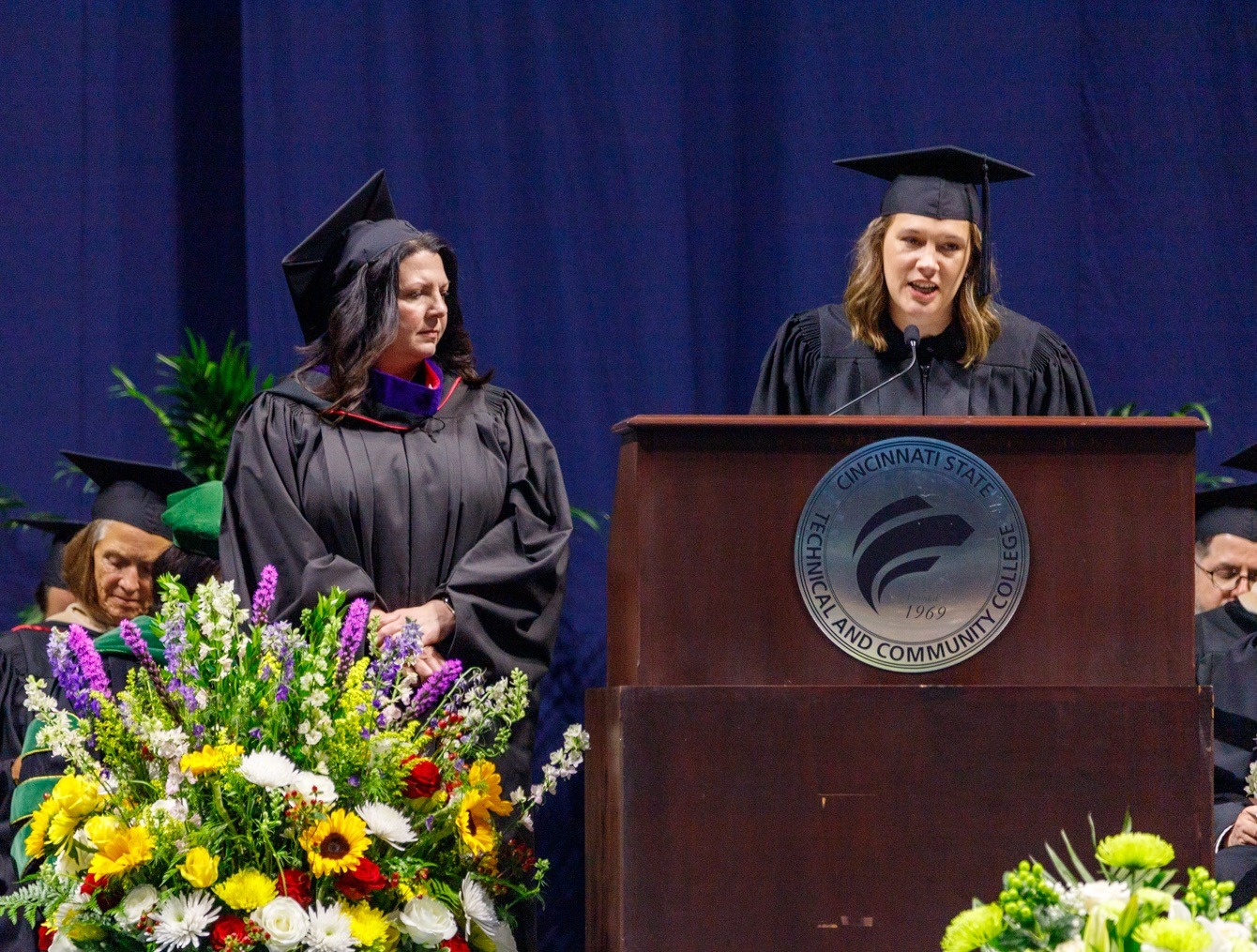 Christie Tuttle, '98, receives the Distinguished Alumni Award from Brittany Collins, Alumni Association President