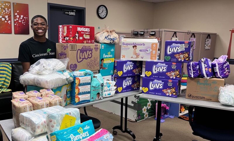 Yoshua Simms with some of the diapers donated to the Parenting Resource Center