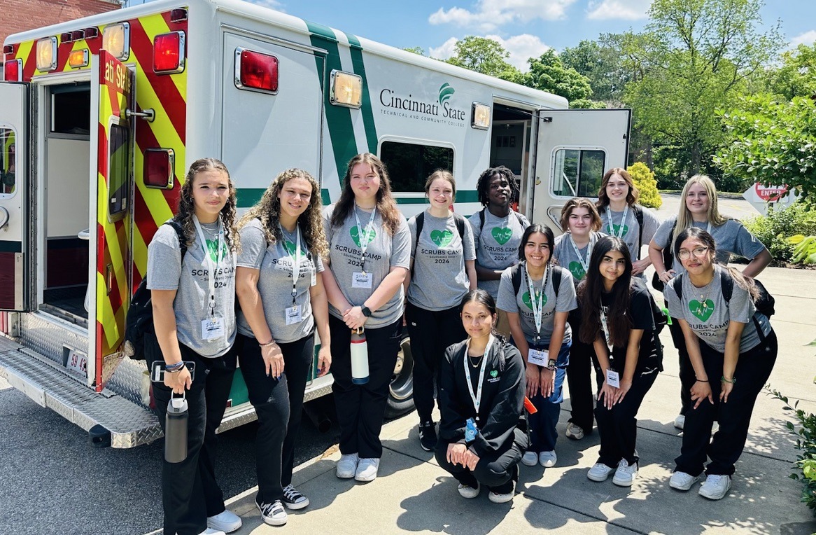 Scrubs Camp 2024 - students with EMS truck