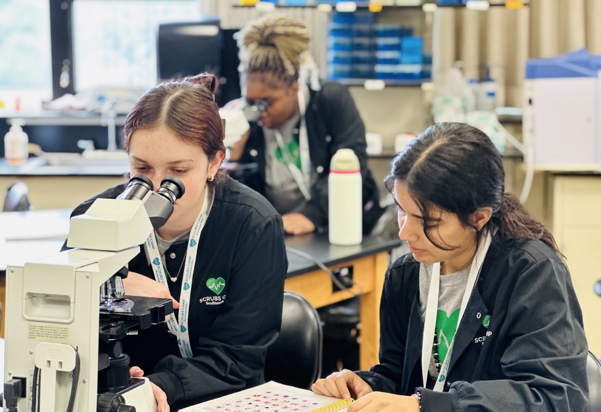 Scrubs Camp 2024- students using microscopes