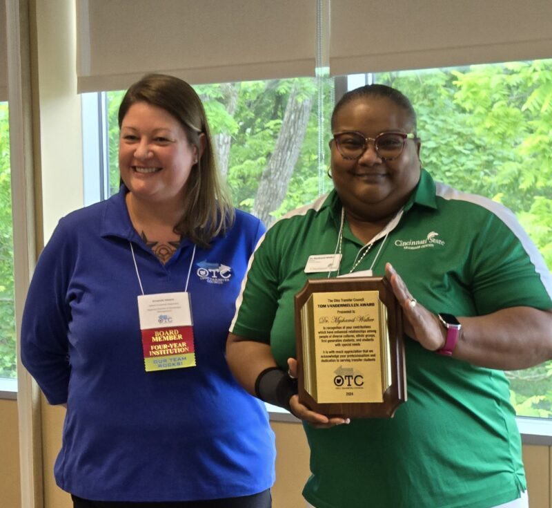 Dr. Myshamil Walker received an award from Amanda Means, president of the Ohio Transfer Council