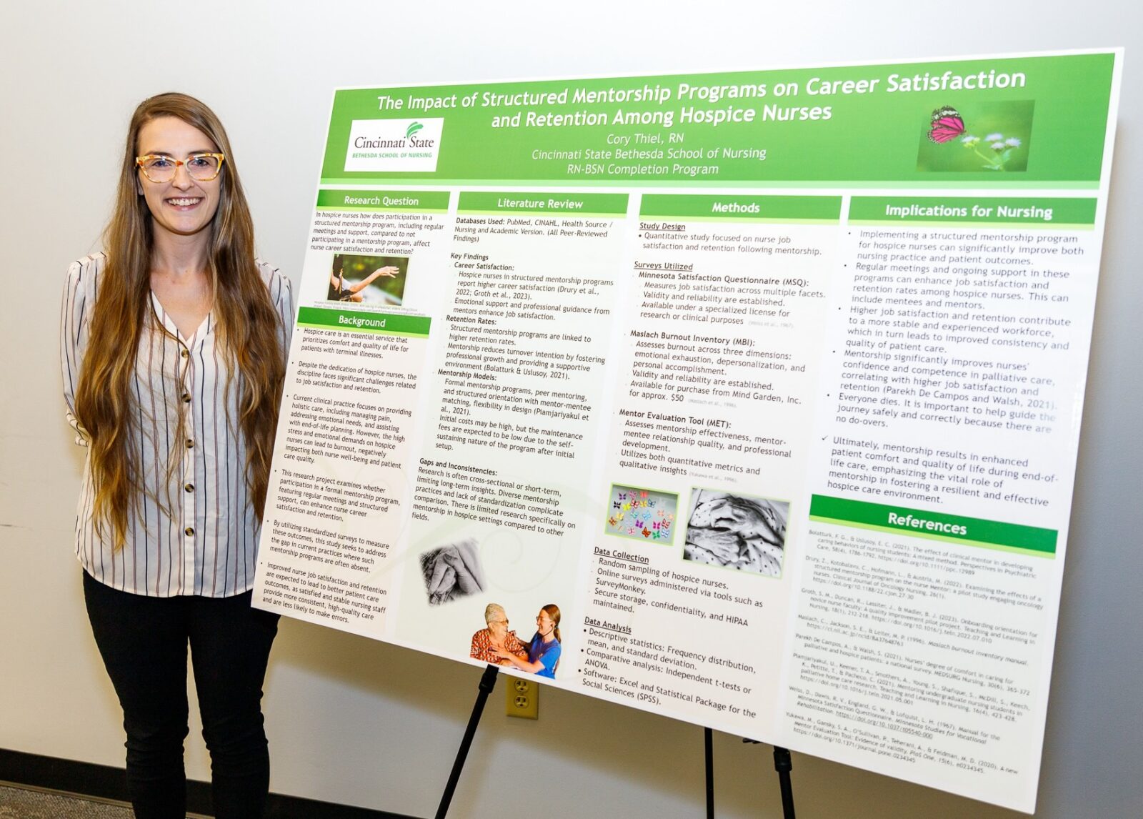 Cory Thiel, RN, with research poster