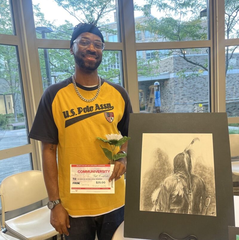 Jamal Lundy displays his drawing 