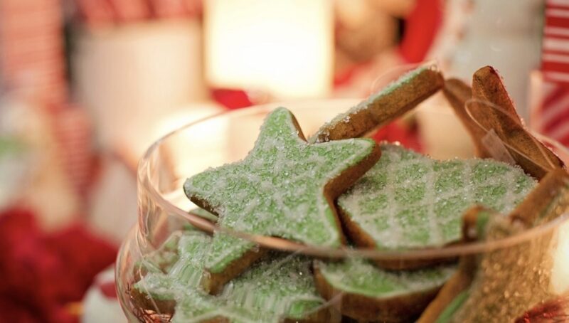 Green star-shaped Christmas cookies on a plate