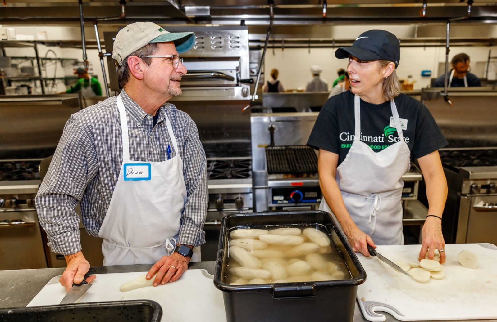 Doug Woodruff chopping potatoes for soup